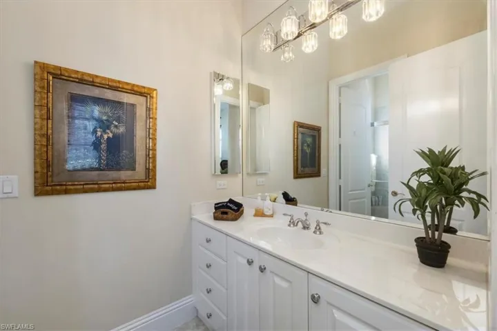 Bathroom with vanity and baseboards