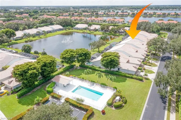 Birds eye view of property featuring a residential view and a water view