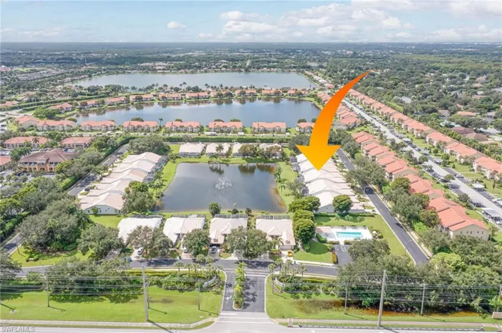 Aerial view featuring a water view and a residential view