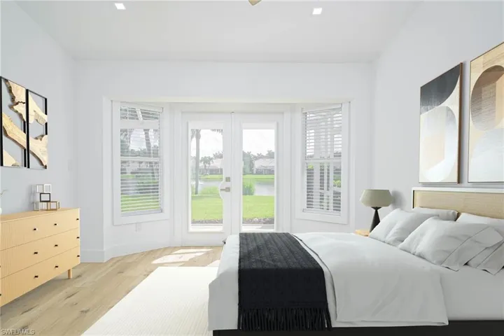 Virtually Staged Bedroom featuring light wood-type flooring, access to outside, multiple windows, and baseboards