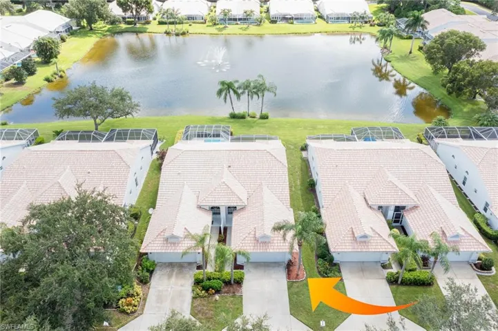 Bird's eye view with a water view and a residential view
