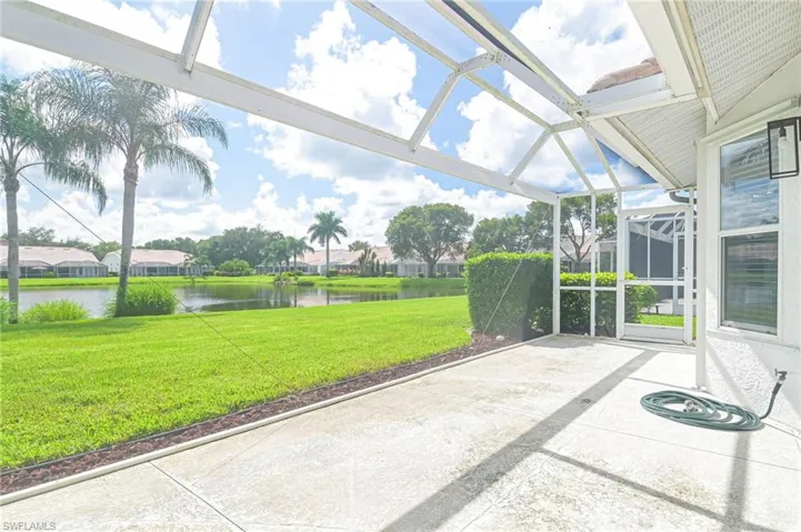 Unfurnished sunroom with a water view