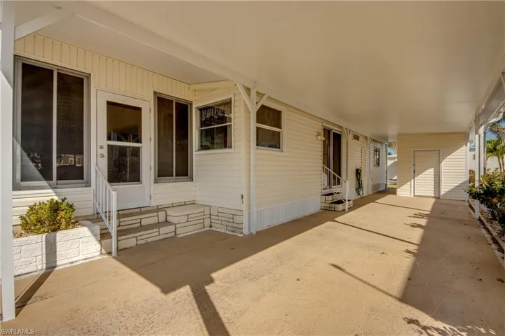 View of patio / terrace featuring entry steps and an attached carport