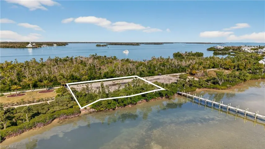 Aerial view of property and surrounding area featuring property parcel outlined