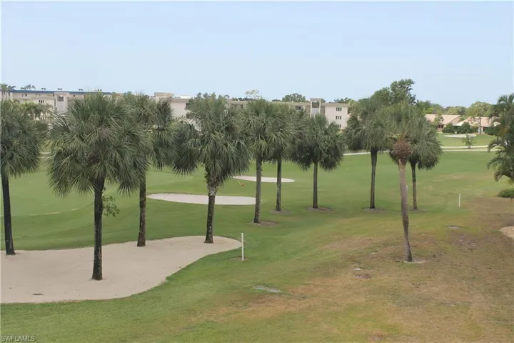 View of property's community featuring a yard and golf course view