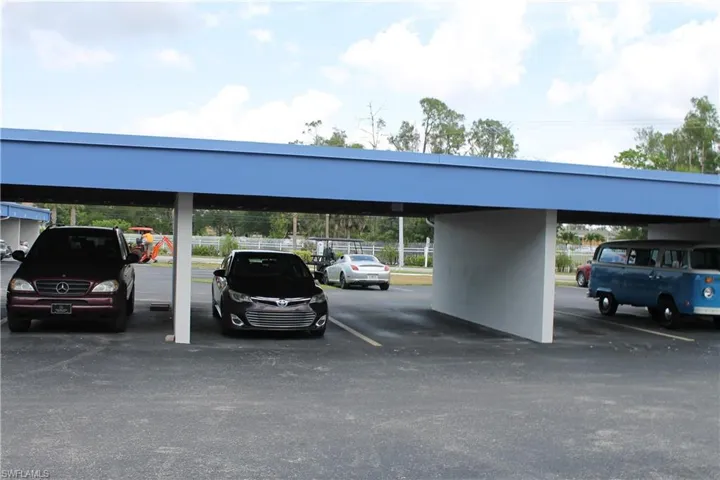 Covered parking lot with fence