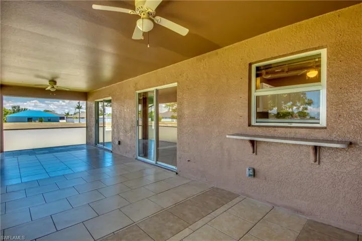 View of patio featuring a ceiling fan