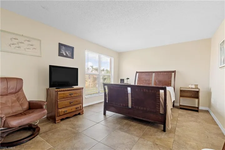 Bedroom featuring a textured ceiling