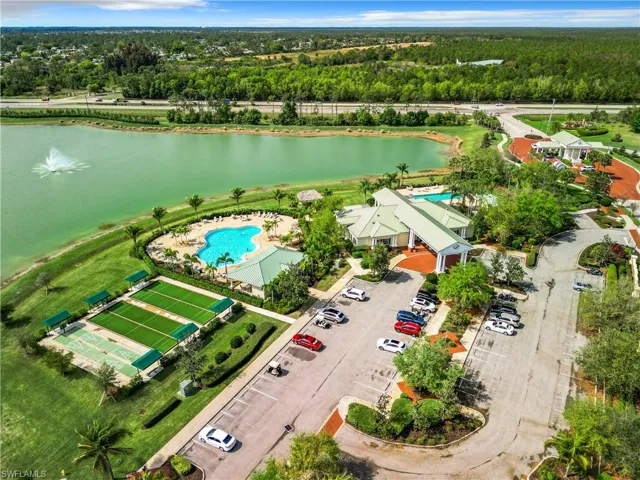 Clubhouse with gym and yoga room, bocce courts, resort-style pool and lap pool. Magnolia gated entrance to can be seen at the top right.