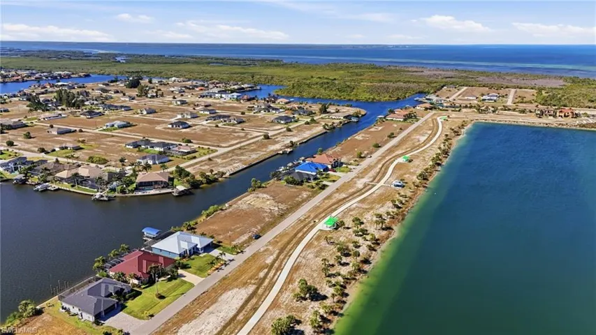 Aerial view of residential area with a nearby body of water