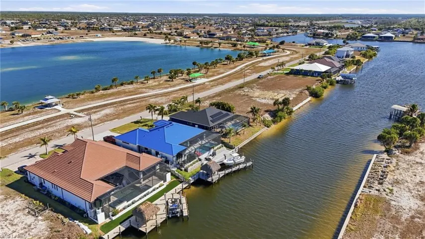 Aerial view of residential area featuring a large body of water