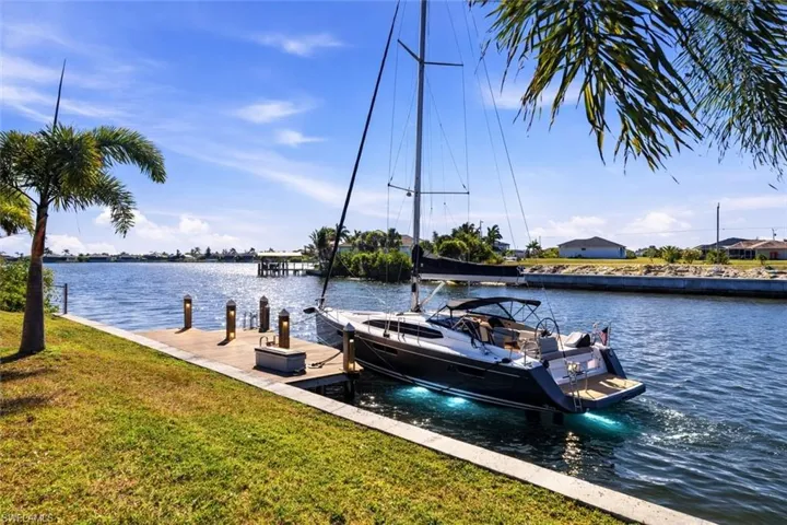 Deep water canal with direct Gulf access and no bridges. Ideal for sailboats and larger vessels with generous draft capability. Enjoy quick, unobstructed boating to open water with wide canal views and excellent turning basin space. A rare opportunity to design your custom dock and create the ultimate waterfront lifestyle. Buyer to verify draft and boating access.