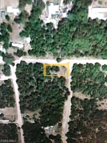 Wooded, corner lot.