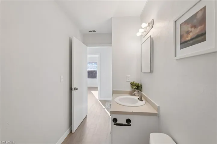 Bathroom featuring vanity and light wood-type flooring