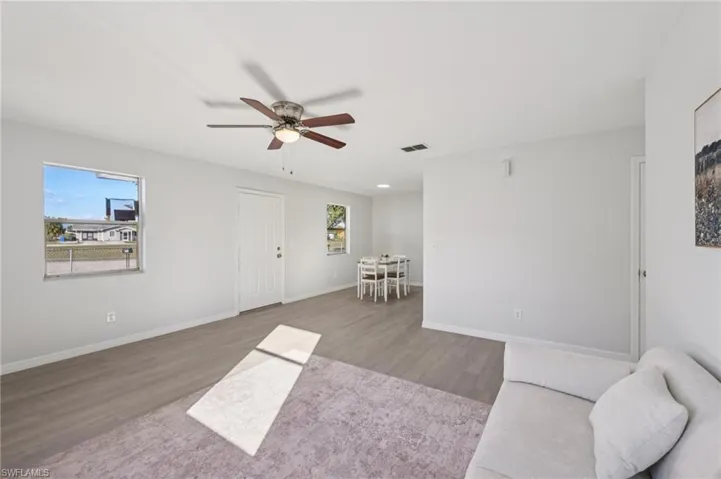 Sitting room featuring wood finished floors and ceiling fan
