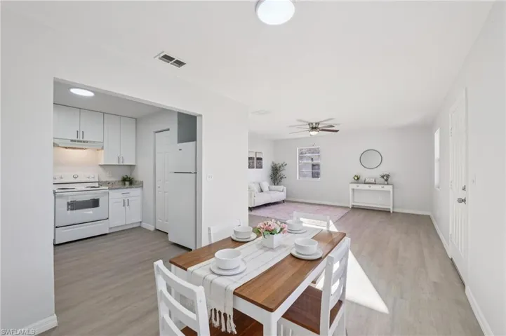 Dining area featuring light wood finished floors and a ceiling fan
