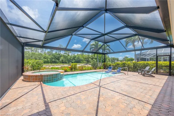 Private relaxing screened lanai overlooking the water