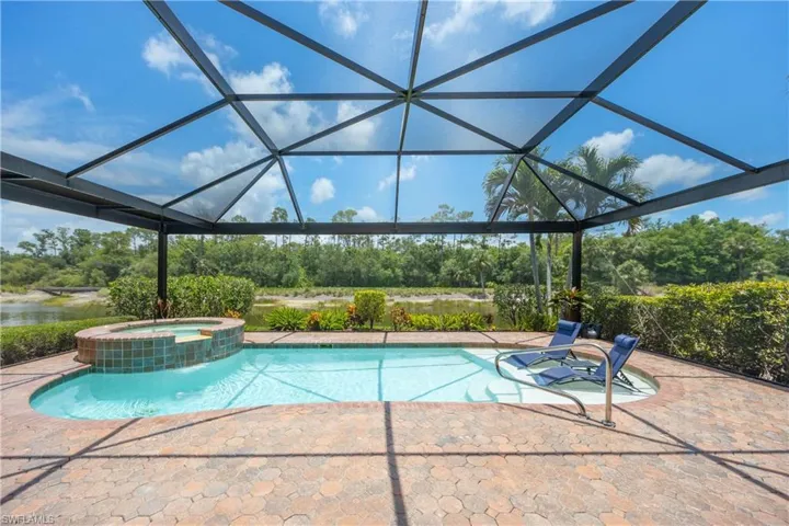 Private relaxing screened lanai overlooking the water