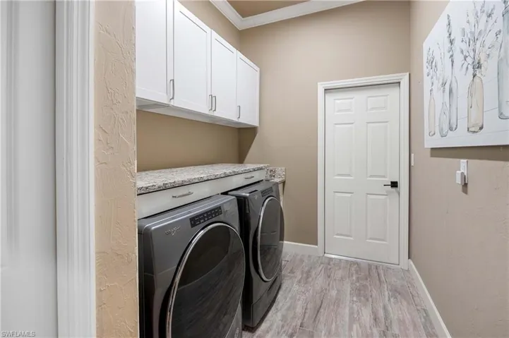 Laundry room with custom cabinets and sink