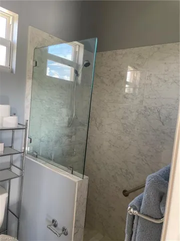 Bathroom with an enclosed shower and toilet