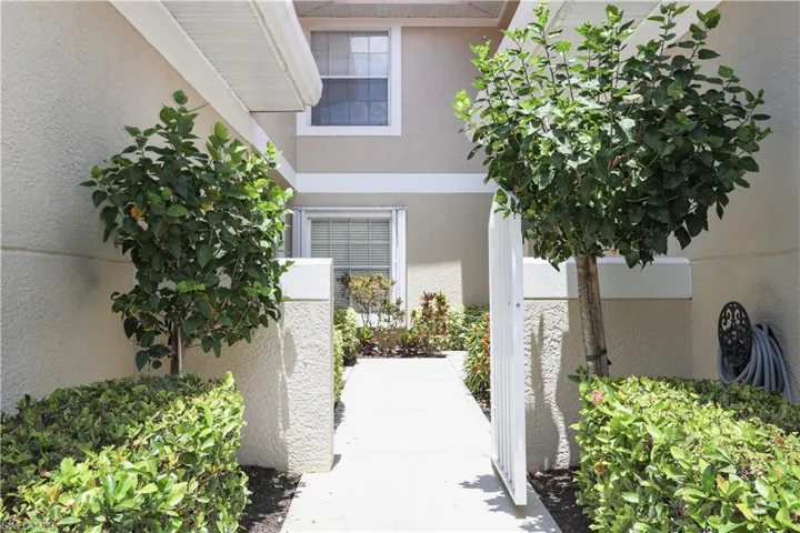 Property entrance featuring stucco siding