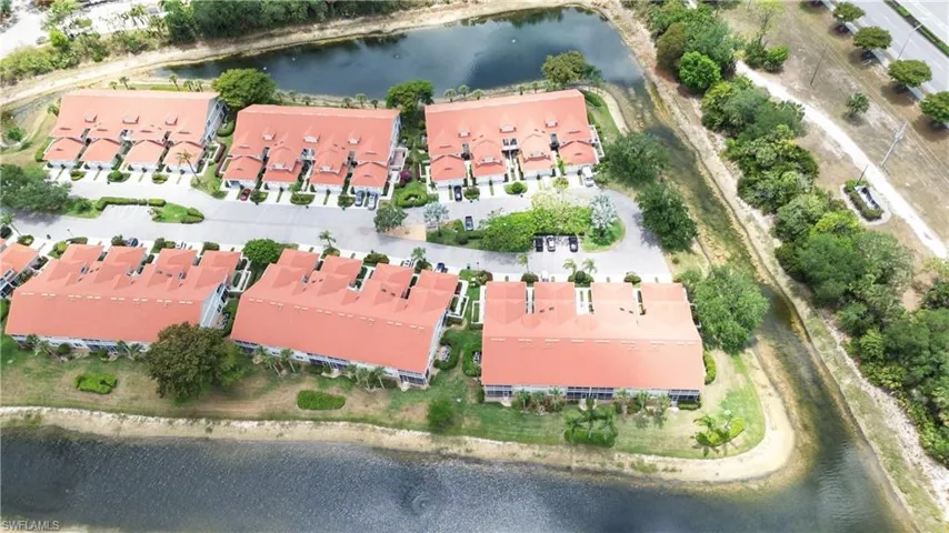 View of property location featuring a large body of water and nearby suburban area