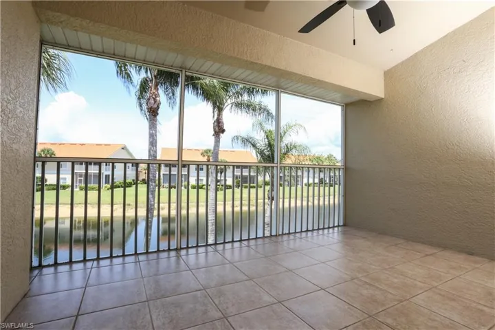 Balcony with ceiling fan and a water view