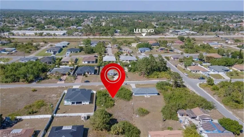 Aerial overview of property's location featuring nearby suburban area