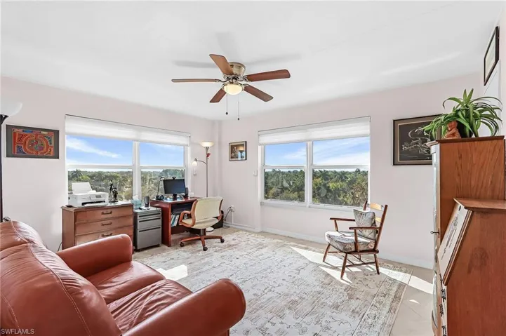 Office featuring a ceiling fan and baseboards