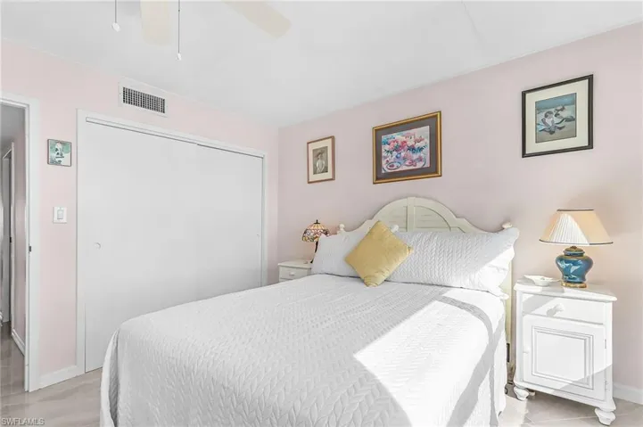 Bedroom featuring a closet and a ceiling fan