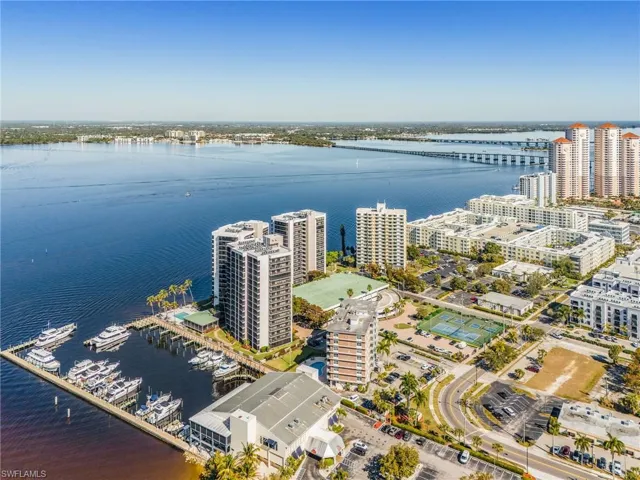 View of urban area with a nearby body of water and a notable bridge