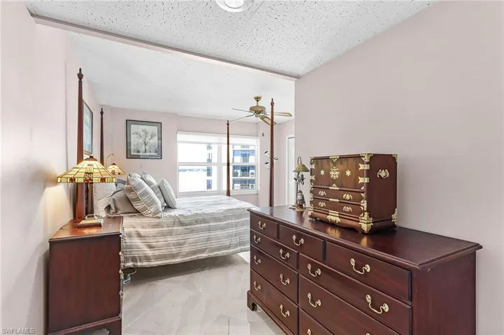 Bedroom with a textured ceiling