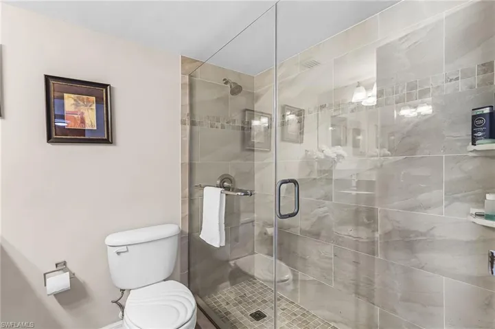 Bathroom with toilet and a shower stall