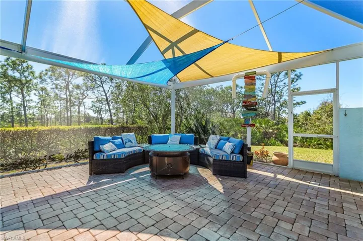 View of patio / terrace with outdoor seating and a sunroom