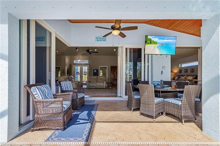 View of patio / terrace featuring outdoor dining space and a ceiling fan