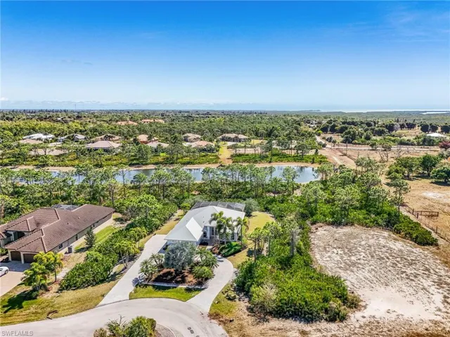Aerial perspective of suburban area with a large body of water