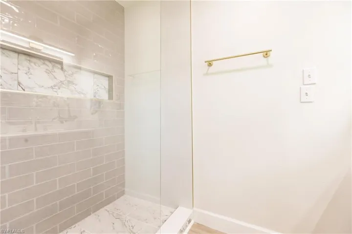 Bathroom with tiled shower