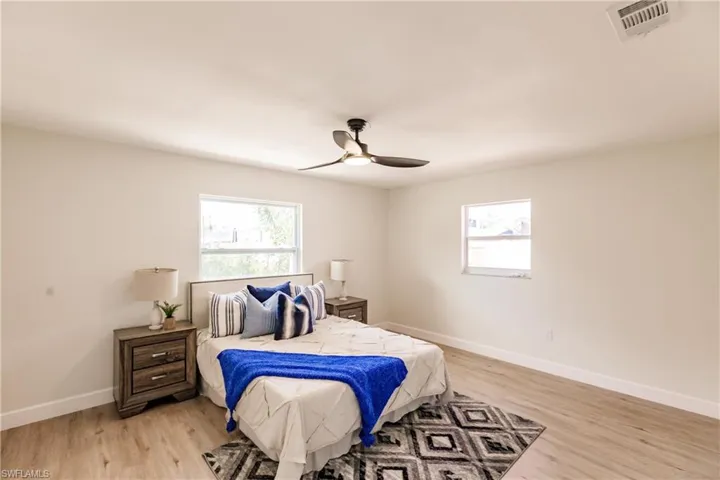 Bedroom with light wood-type flooring and ceiling fan