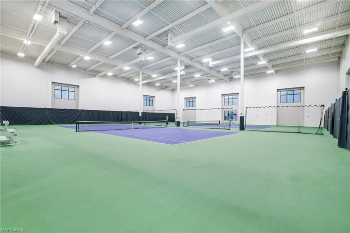 View of tennis court with fence