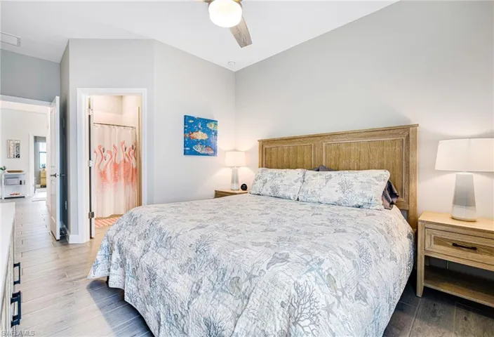 Bedroom with a ceiling fan and wood finished floors