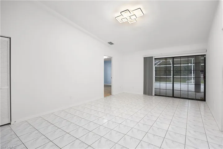 Empty room featuring baseboards