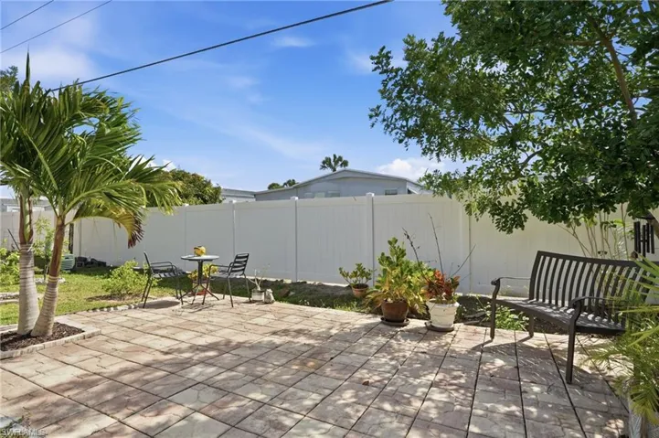 REAR OUTDOOR LIVING SPACE WITH PATIO...