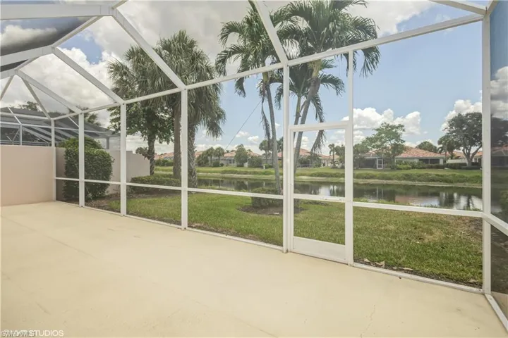 Unfurnished sunroom with a water view
