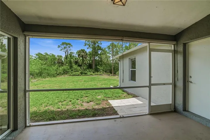 Screened-in lanai overlooking a large open space!