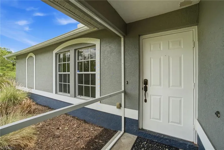 Screened-in entryway to property.