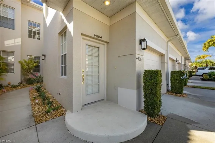 Doorway to property with stucco siding