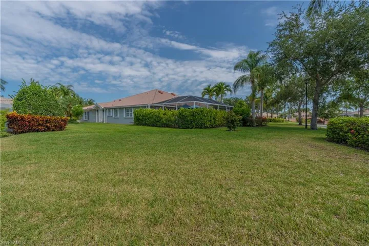 View of yard featuring a lanai