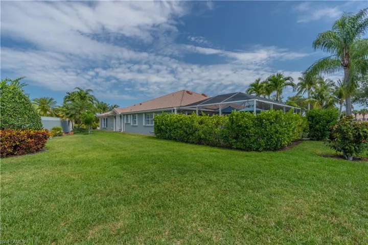 View of yard with a lanai