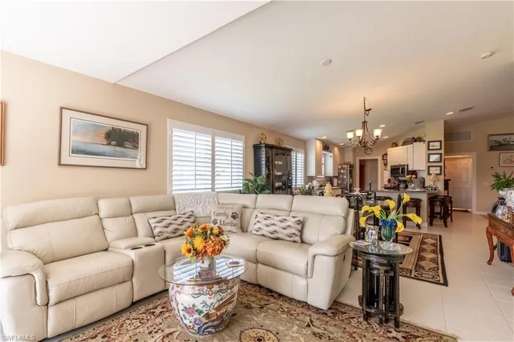 Living room featuring a chandelier and light tile floors