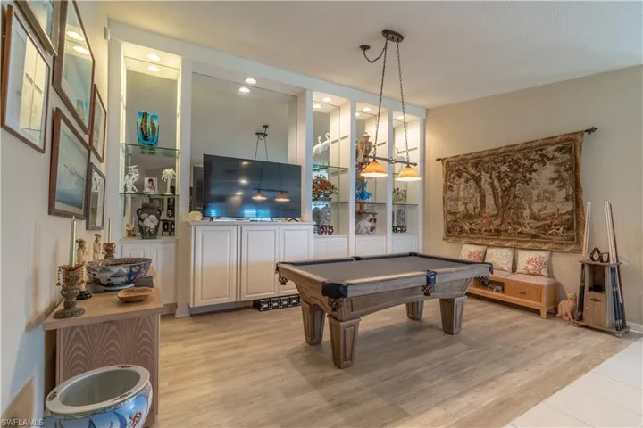 Game room featuring pool table and light hardwood / wood-style flooring